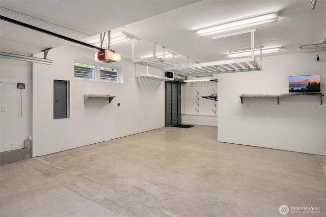 garage featuring a garage door opener and electric panel