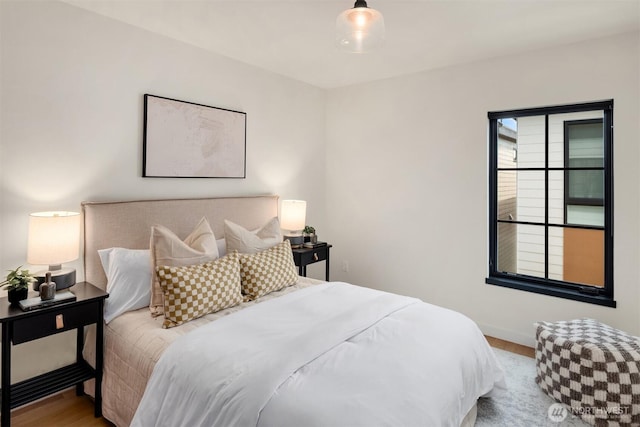 bedroom featuring wood finished floors