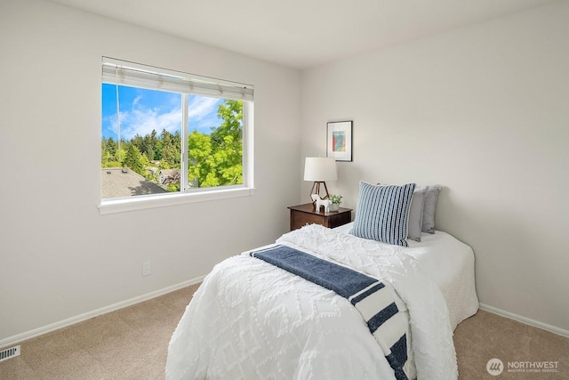 carpeted bedroom with baseboards