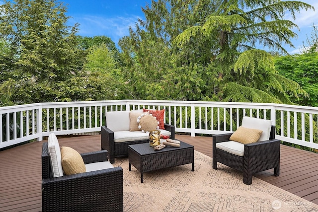 wooden terrace with outdoor lounge area
