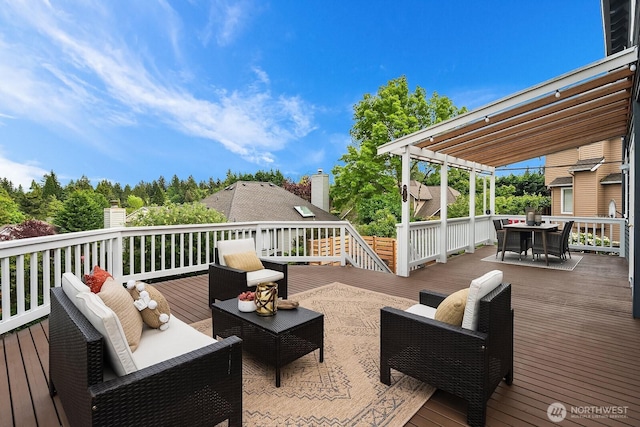 wooden deck with outdoor dining area and an outdoor hangout area