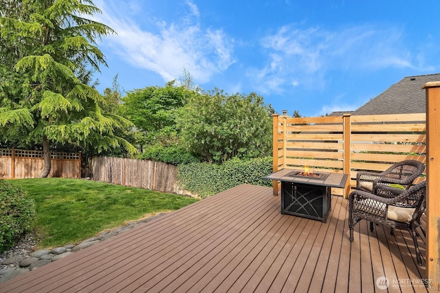 wooden deck with an outdoor fire pit