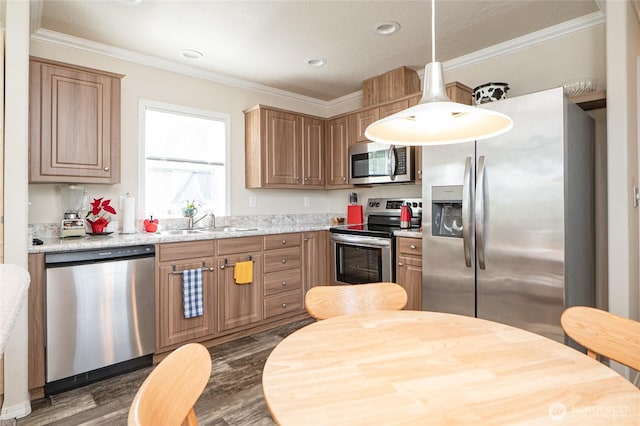 1200 Lincoln St Unit 121, Bellingham, WA 98229 - kitchen featuring appliances with stainless steel finishes, a sink, dark wood finished floors, crown molding, and hanging light fixtures