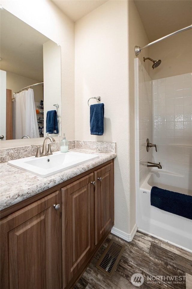 1200 Lincoln St Unit 121, Bellingham, WA 98229 - bathroom with wood finished floors, vanity, baseboards, and shower / bath combination with curtain