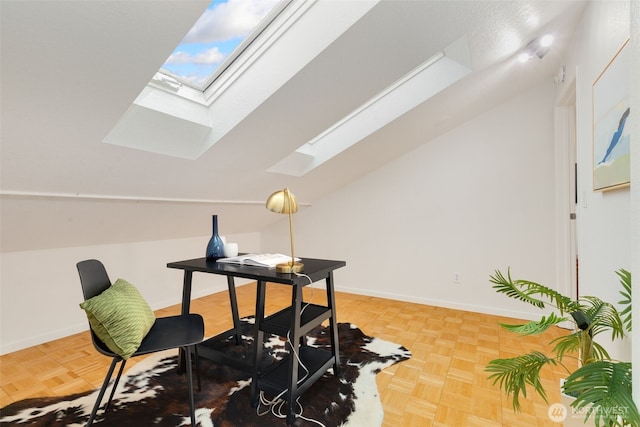 7 Lake Bellevue Dr Unit 208, Bellevue, WA 98005 - home office featuring a skylight, lofted ceiling, and baseboards
