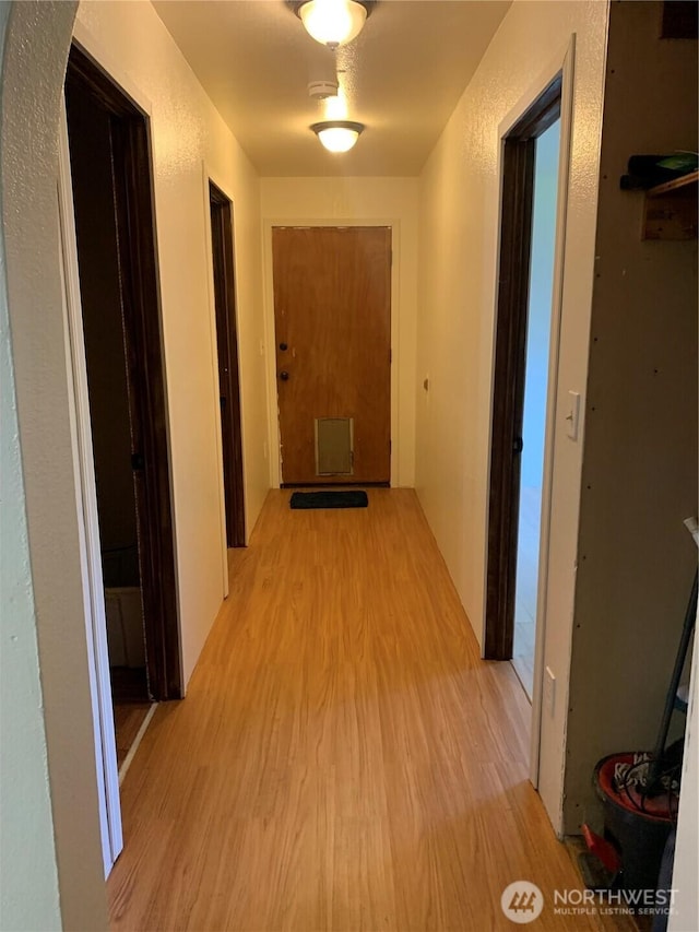 111 3rd St, Port Hadlock, WA 98339 - hall with light wood-style flooring and arched walkways