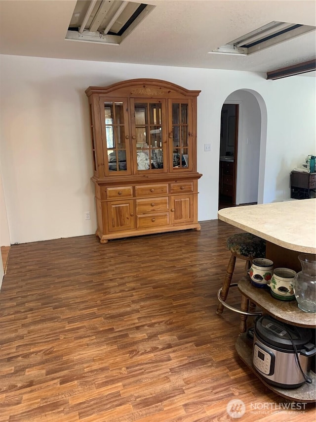 111 3rd St, Port Hadlock, WA 98339 - dining room featuring arched walkways and dark wood-type flooring