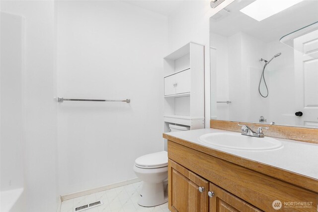 27922 146th Ave SE, Kent, WA 98042 - full bathroom with toilet, vanity, baseboards, and a shower