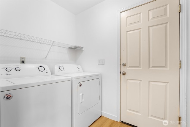 27922 146th Ave SE, Kent, WA 98042 - washroom featuring separate washer and dryer, light wood-type flooring, and baseboards