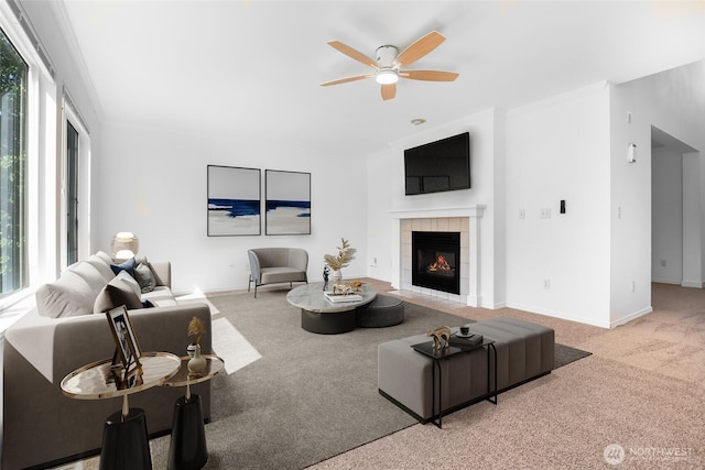 27922 146th Ave SE, Kent, WA 98042 - living area with carpet floors, ceiling fan, a tiled fireplace, and baseboards