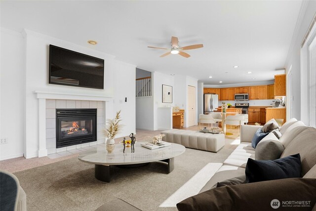 27922 146th Ave SE, Kent, WA 98042 - living area with light carpet, ceiling fan, recessed lighting, and a tiled fireplace