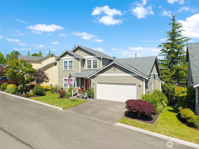 9619 Windswept Ln NW, Silverdale, WA 98383 - view of front of property featuring an attached garage, concrete driveway, a front lawn, board and batten siding, and a shingled roof