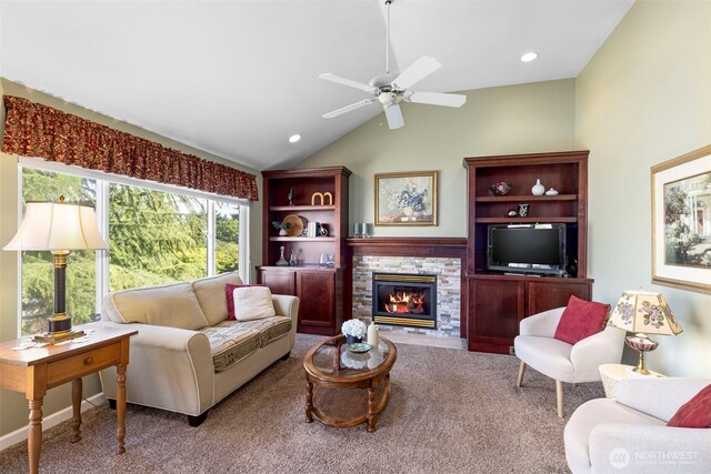 9619 Windswept Ln NW, Silverdale, WA 98383 - carpeted living area featuring vaulted ceiling, a stone fireplace, ceiling fan, and recessed lighting