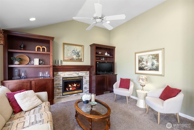 9619 Windswept Ln NW, Silverdale, WA 98383 - living area with lofted ceiling, carpet, a stone fireplace, and ceiling fan