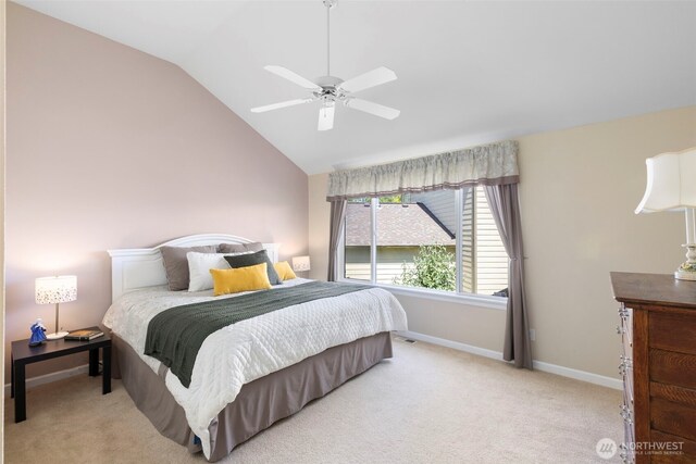 9619 Windswept Ln NW, Silverdale, WA 98383 - carpeted bedroom featuring lofted ceiling and a ceiling fan