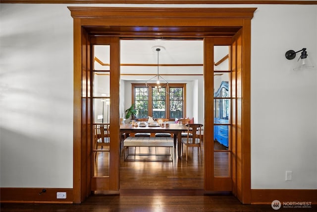 dining area with dark wood-style flooring