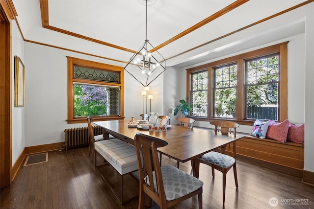 dining space with baseboards, radiator, a chandelier, dark wood-style floors, and ornamental molding