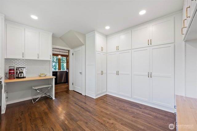 kitchen with white cabinets, dark wood-type flooring, dishwasher, decorative backsplash, and recessed lighting