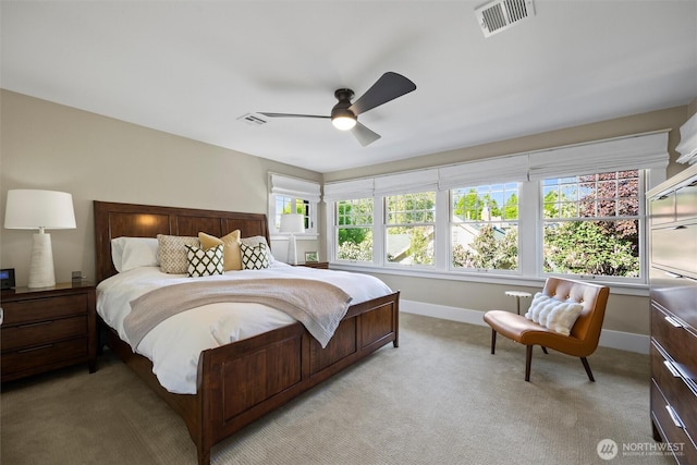 bedroom featuring baseboards, light carpet, and a ceiling fan