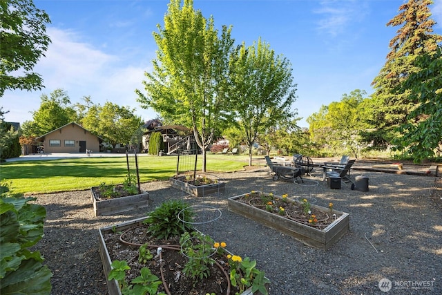 view of property's community featuring a vegetable garden and a lawn