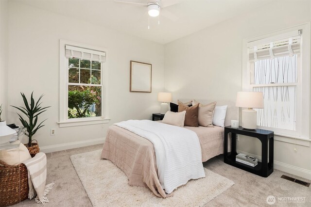 bedroom with carpet and baseboards