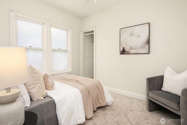 bedroom with carpet flooring and baseboards