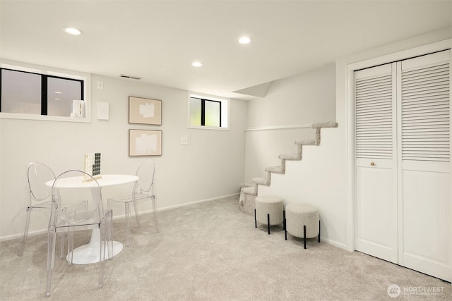 living area with carpet, recessed lighting, baseboards, and stairs