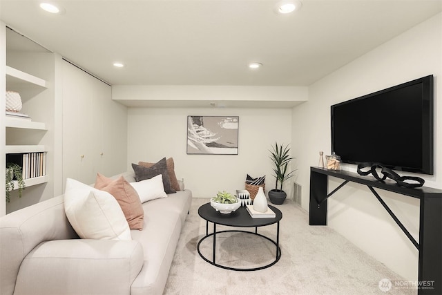 carpeted living room with recessed lighting