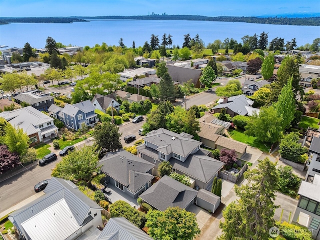aerial perspective of suburban area featuring a large body of water