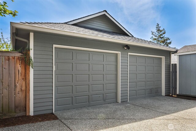 detached garage with fence