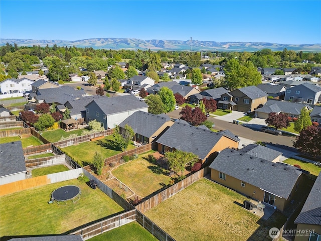 aerial perspective of suburban area featuring a mountainous background