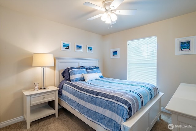 bedroom featuring light colored carpet, baseboards, and a ceiling fan