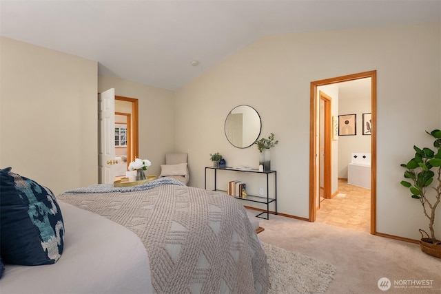 bedroom with lofted ceiling, light colored carpet, and baseboards