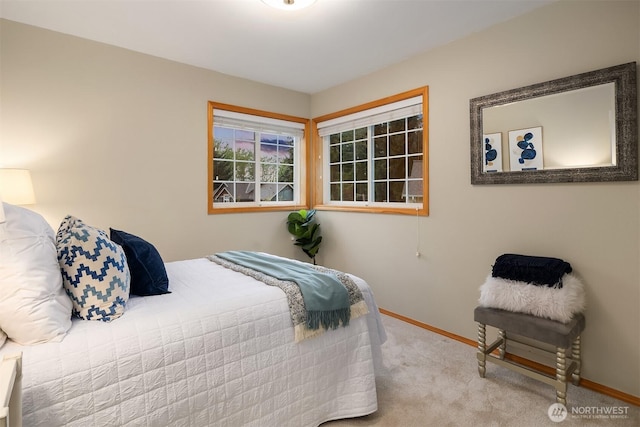 carpeted bedroom with baseboards
