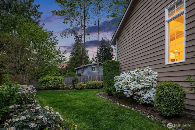 view of yard at dusk