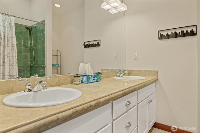 full bath featuring double vanity and tiled shower