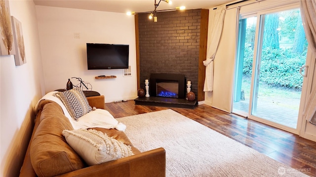 living area featuring wood finished floors and a fireplace