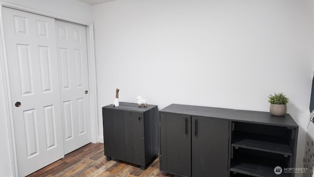 office with dark wood-type flooring