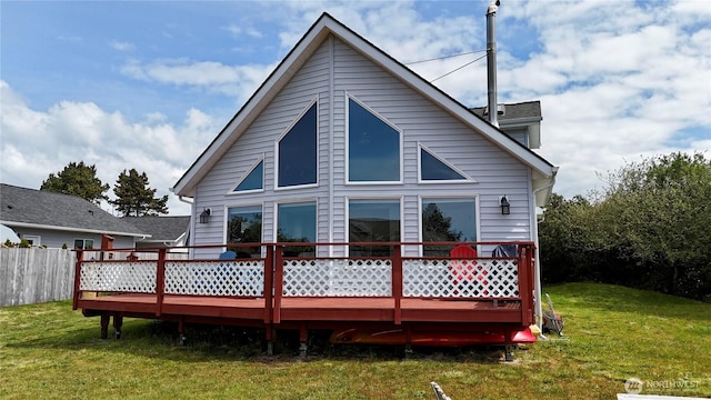 195 N Razor Clam Dr SW, Ocean Shores, WA 98569 - rear view of house with a deck and a yard