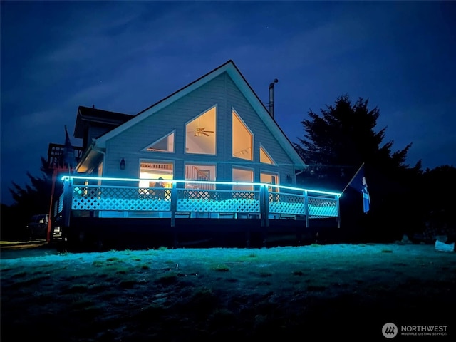 195 N Razor Clam Dr SW, Ocean Shores, WA 98569 - back of house at twilight featuring a deck