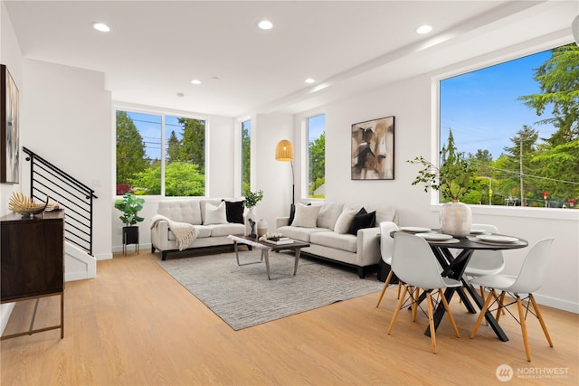 1911C N 120th St, Seattle, WA 98133 - living room featuring light wood-style flooring, recessed lighting, baseboards, and stairway