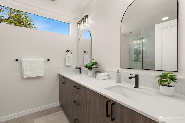 1911C N 120th St, Seattle, WA 98133 - full bathroom with baseboards, double vanity, tile patterned flooring, and tiled shower
