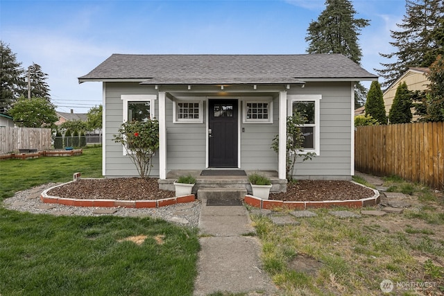 view of front of house with roof with shingles