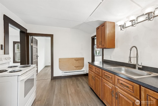 kitchen featuring white electric range oven, a sink, baseboard heating, brown cabinetry, and dark countertops