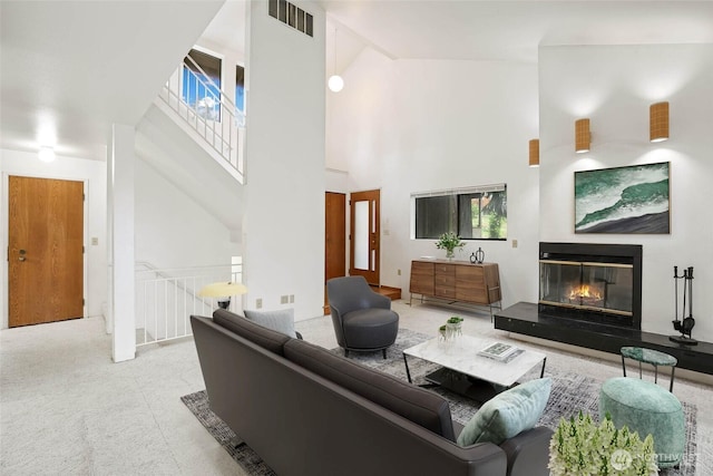 6612 4th St E, Tacoma, WA 98424 - carpeted living area with high vaulted ceiling and a glass covered fireplace