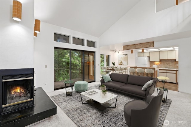 6612 4th St E, Tacoma, WA 98424 - living room featuring high vaulted ceiling and a multi sided fireplace