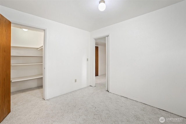 6612 4th St E, Tacoma, WA 98424 - unfurnished bedroom featuring carpet floors, a walk in closet, and a closet