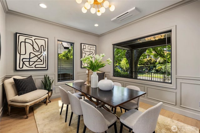 3018 22nd Ave W, Seattle, WA 98199 - dining space with a chandelier, light wood-type flooring, healthy amount of natural light, ornamental molding, and recessed lighting