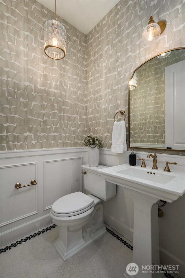 3018 22nd Ave W, Seattle, WA 98199 - bathroom featuring toilet, tile patterned floors, and wainscoting