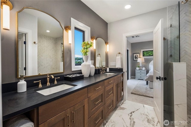 3018 22nd Ave W, Seattle, WA 98199 - ensuite bathroom featuring marble finish floors, double vanity, tiled shower, and recessed lighting